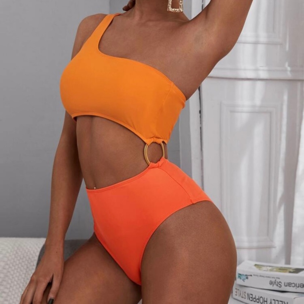 One piece orange bathing suit.